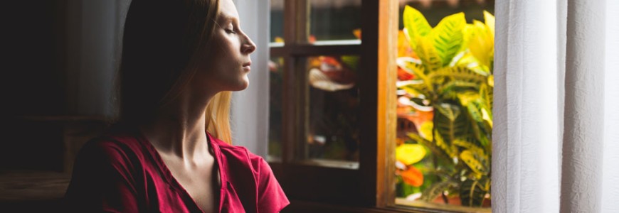 women reflecting at window
